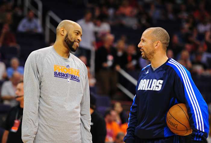 Dallas Mavericks guard Jason Kidd (right) talks with Phoenix Suns guard Vince Carter prior to the game at the US Airways Center